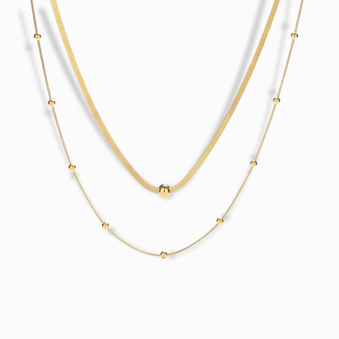 18K Gold Plated Layered Chain Necklace with snake and beaded chain details.