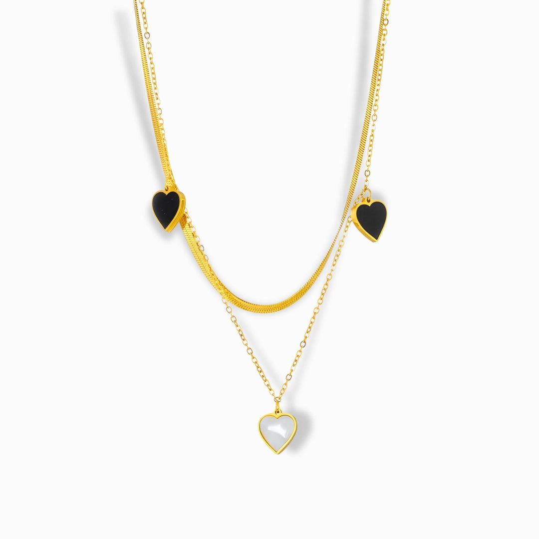 18K Gold Plated Layered Necklace with black and white heart pendants.