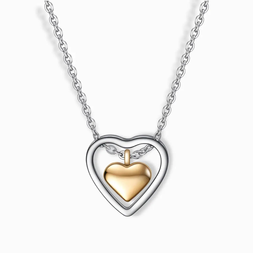 Stainless steel two-tone heart pendant necklace in silver and gold plating.