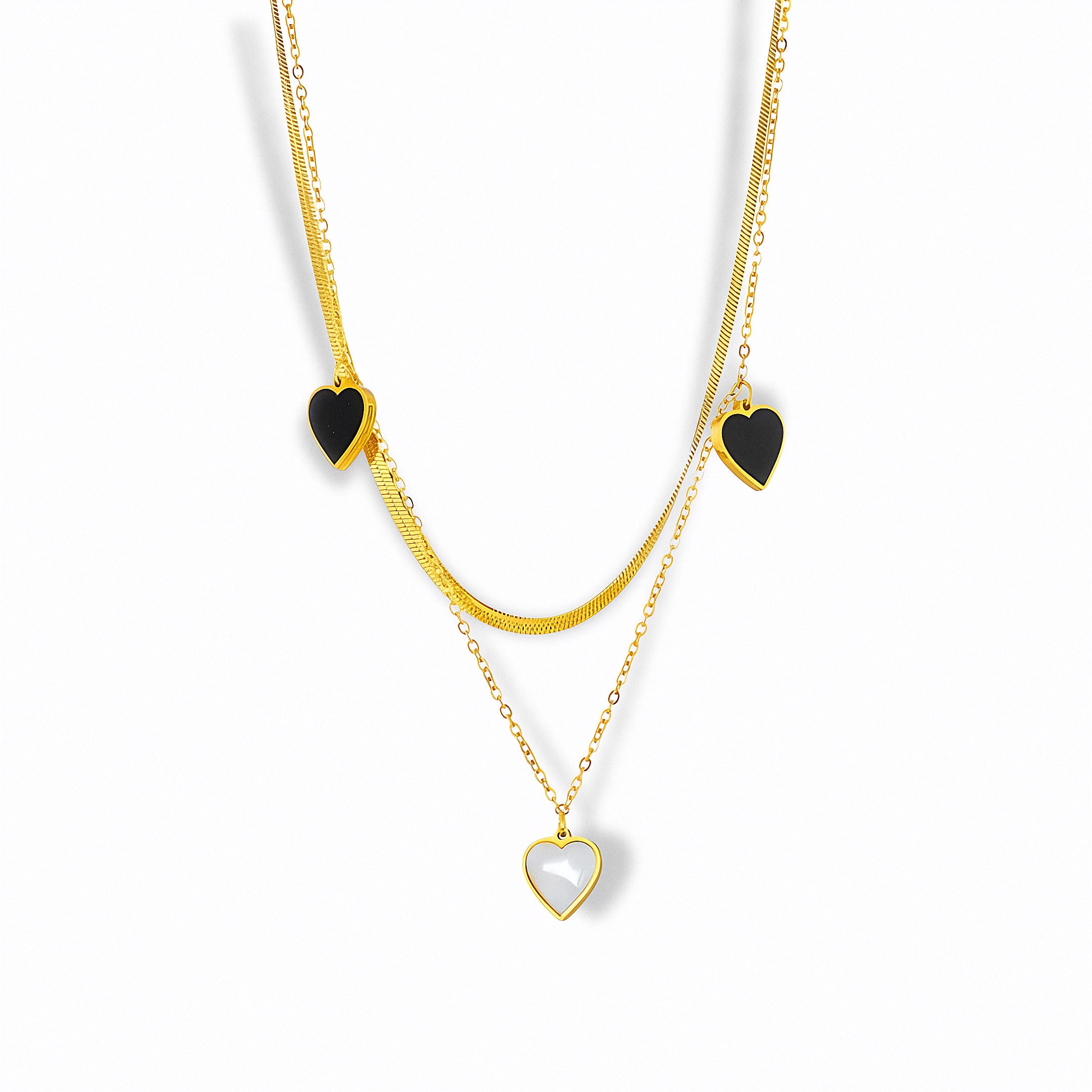 Glozya layered heart necklace — 18K gold-plated dual chain with two black enamel hearts and a white mother-of-pearl heart